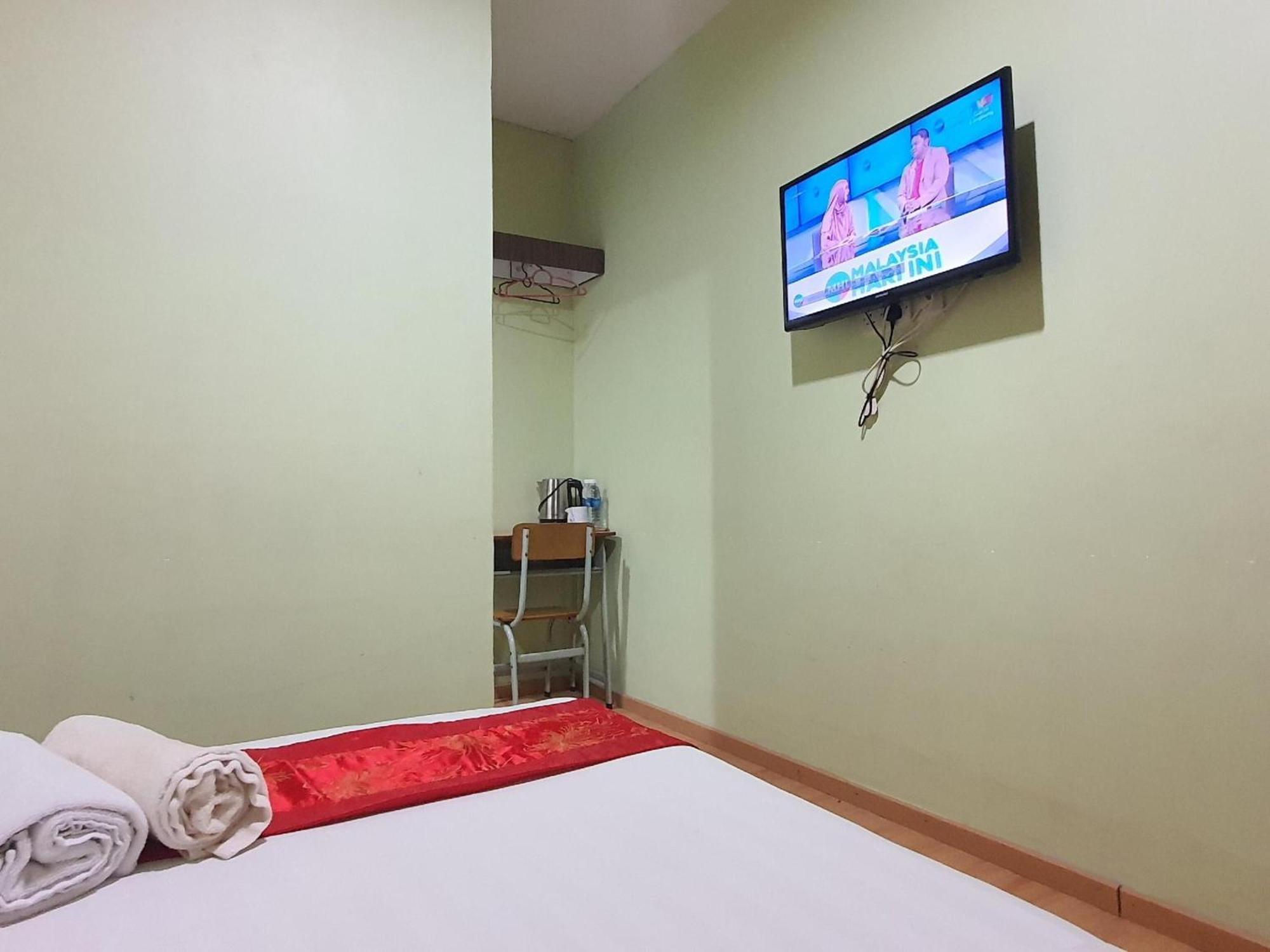Oyo 90964 Melody 88 Inn Miri Bagian luar foto